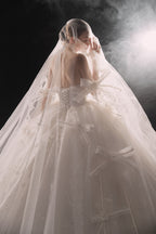 Ethereal Strapless Tulle Ball Gown Wedding Dress with Cathedral Train & Delicate Bows