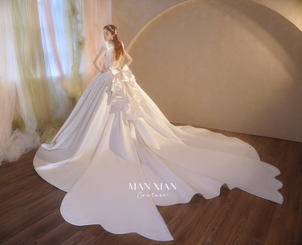 Regal V-Neck Satin Ball Gown Wedding Dress with Oversized Bow & Cathedral Train