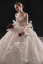Ethereal Strapless Tulle Ball Gown Wedding Dress with Cathedral Train & Delicate Bows